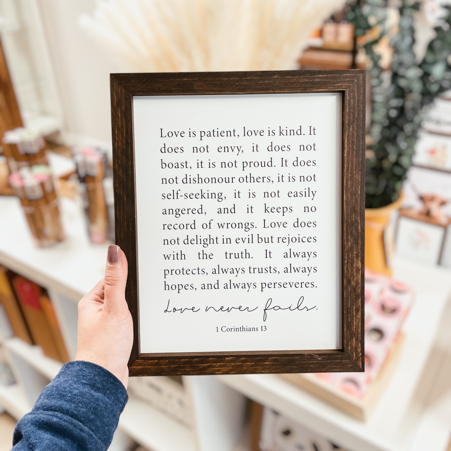 Knotty Design Co. - Love Never Fails Framed Wood Sign