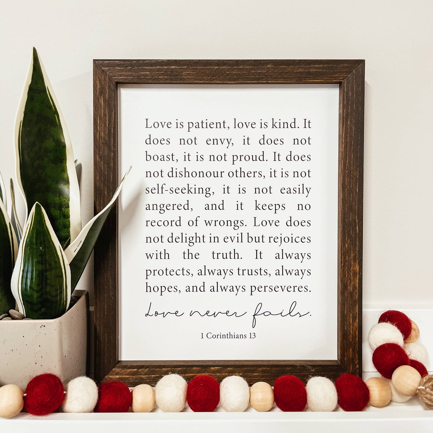 Knotty Design Co. - Love Never Fails Framed Wood Sign