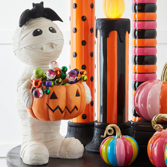 Transform your Halloween decor with this 25" Mummy Serving Butler from Raz Imports. With a playful yet spooky design, this standing mummy holds a jack-o'-lantern bucket filled with treats. Made of resin, the 12.5" L X 14" W X 25" H dimensions make it the perfect addition to your trick-or-treat station or party.
 Item # RZ-4511722
Multicolor
Made of Resin
Measures 12.5" L X 14" W X 25" H
For Decorative Use Only