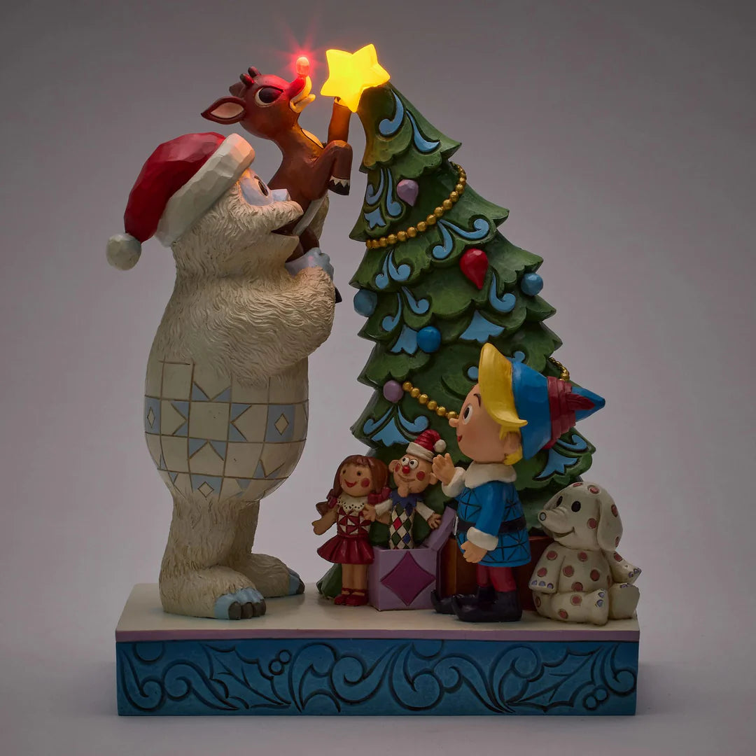 Bumble Holding Rudolph by Tree