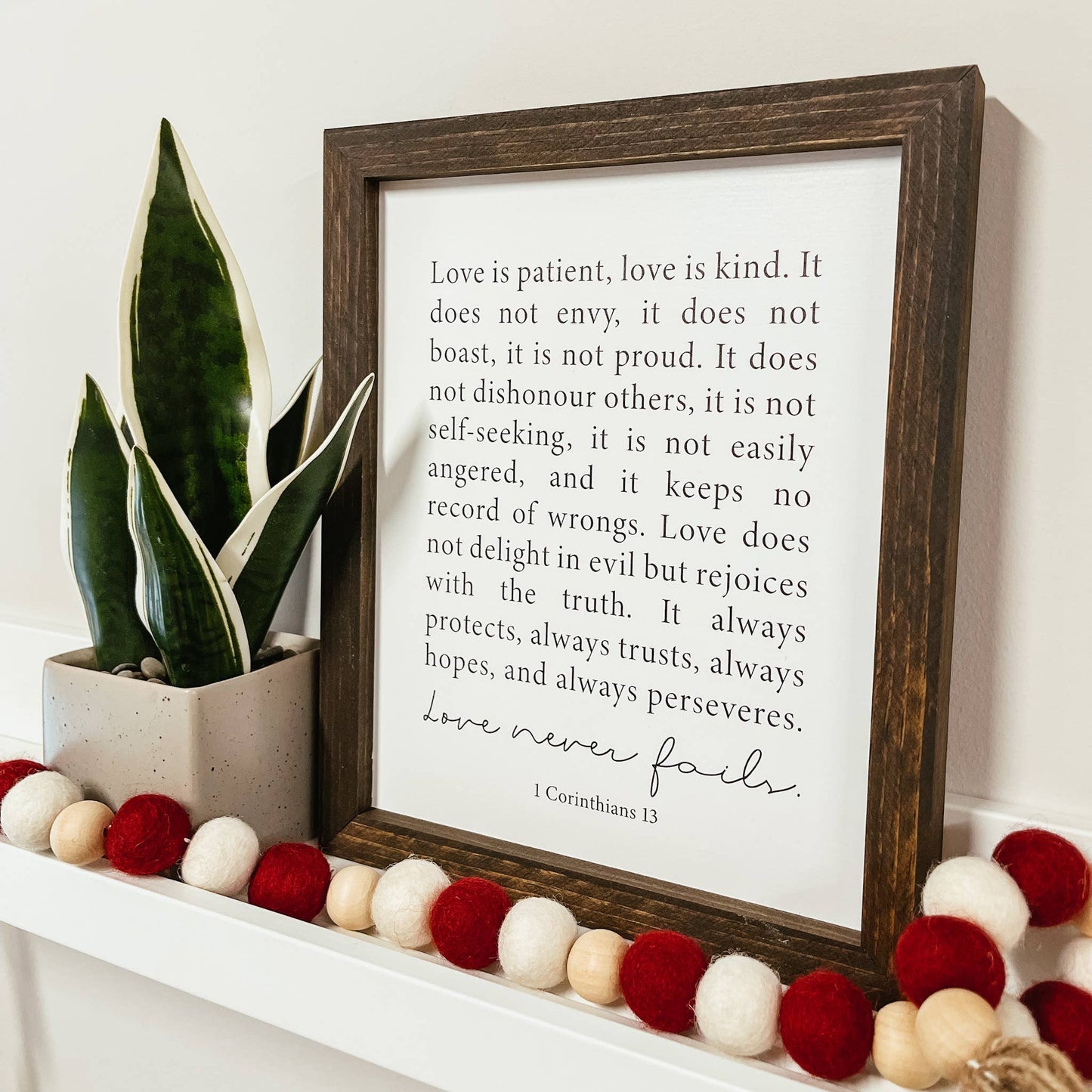 Knotty Design Co. - Love Never Fails Framed Wood Sign