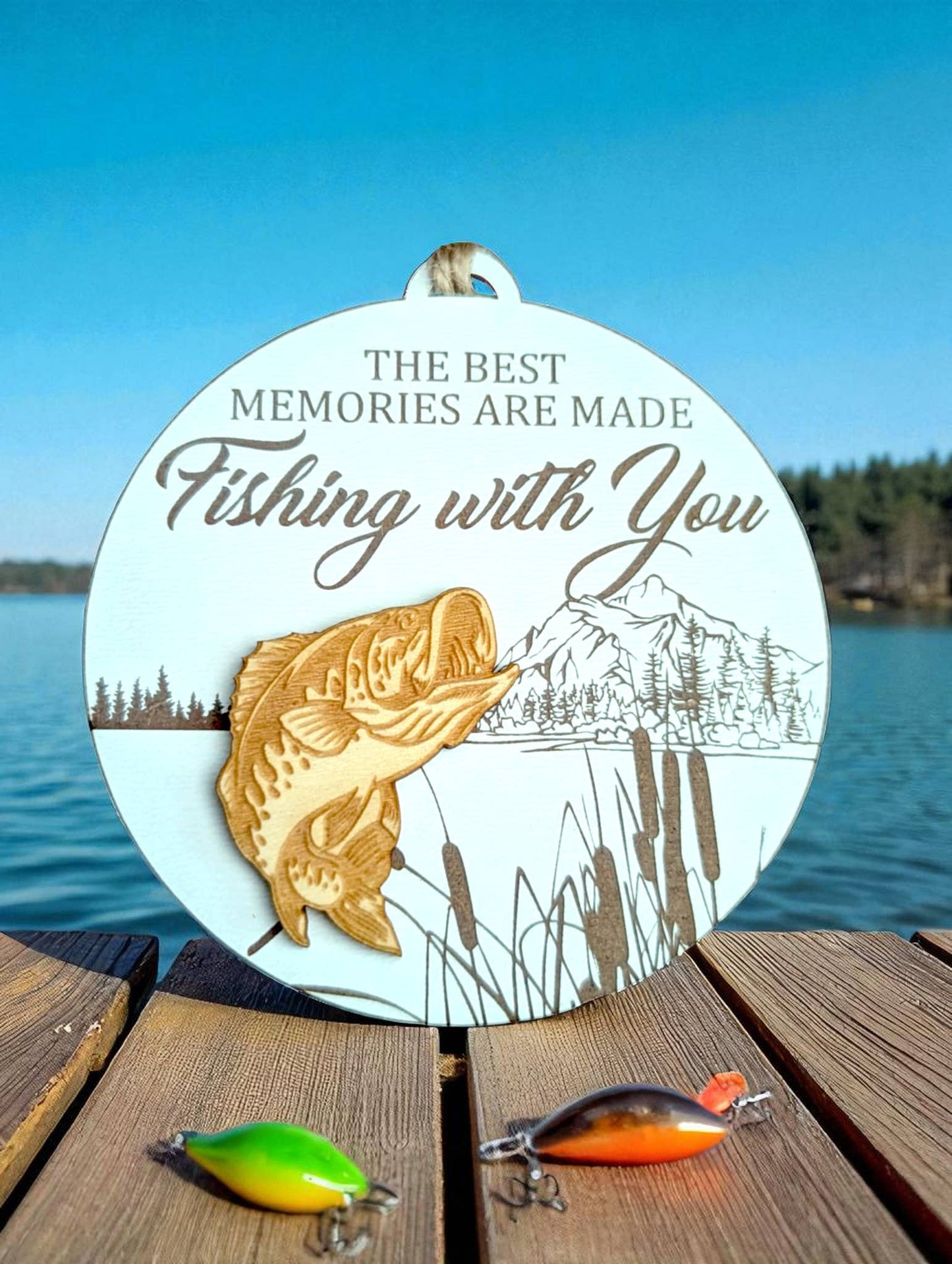 Introducing the Fishing With You Ornament from Richer Design Co. This delightful keepsake is intricately laser cut and engraved, featuring impressive 3D wooden details. At 3.5", it's the perfect addition to any seasonal decor. Each piece is a labor of love, designed, cut, assembled, and shipped from our home studio in Cannington ON. Reflecting the passion of a family-run business, this ornament adds a touch of warmth to your home.