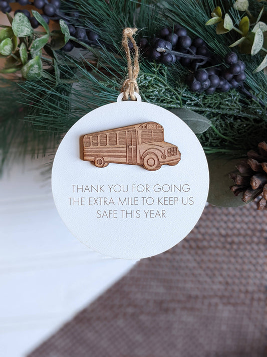 This Richer Design Co. bus driver ornament is a perfect gift to show appreciation for a hardworking driver. Expertly crafted with laser cut and engraved details, it features the sentiment "Thanks for keeping us safe this year." A timeless piece that can be proudly displayed for years to come.