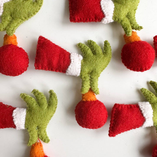 Sewing Seeds Play - One Felt Grinch Hand Holding An Ornament 