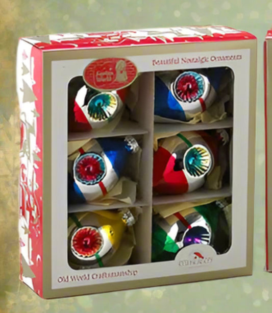These Kurt Adler Early Years glass ornaments are a beautiful addition to any holiday décor or Christmas tree. Features shiny vintage style ornaments with glitter embellishments. Tear drop shape, painted with bright colours and adorned with glitter. Warning, known to cause pings of nostalgia & beautiful memories. Will also create some new memories for your own loved ones. Comes in vintage style box


