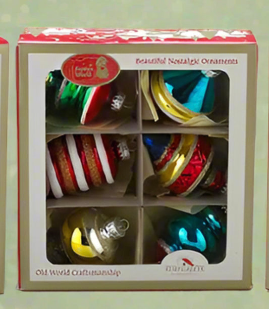 These Kurt Adler Early Years glass ornaments are a beautiful addition to any holiday décor or Christmas tree. Features shiny vintage style ornaments with glitter embellishments. Assorted shapes, painted with bright colours and adorned with glitter. Warning, known to cause pings of nostalgia & beautiful memories. Will also create some new memories for your own loved ones. Comes in vintage style box

Part of Kurt Adler's Early Years collection
Made of glass
A Vintage touch to any holiday décor or Christmas tr