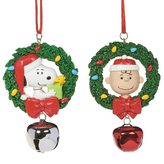 Infuse your holiday tree with joyful cheer using this delightful Jingle Buddies ornament set, featuring Snoopy and Charlie Brown. Each charming ornament is beautifully decorated with a festive wreath, colorful lights, and a jingling metal bell, adding a touch of jolly charm and seasonal magic to your Christmas decor.

Material: Resin and Metal

Size: 4" H each