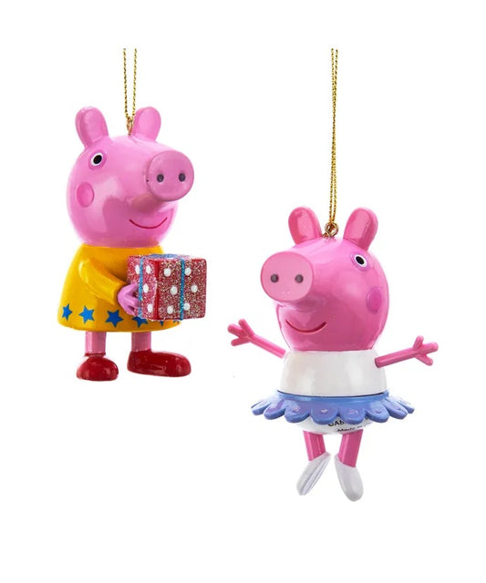 Licensed Peppa Pig Christmas Tree Ornaments. Sold Individually. One is wearing a white dress. Other is wearing a yellow dress. 