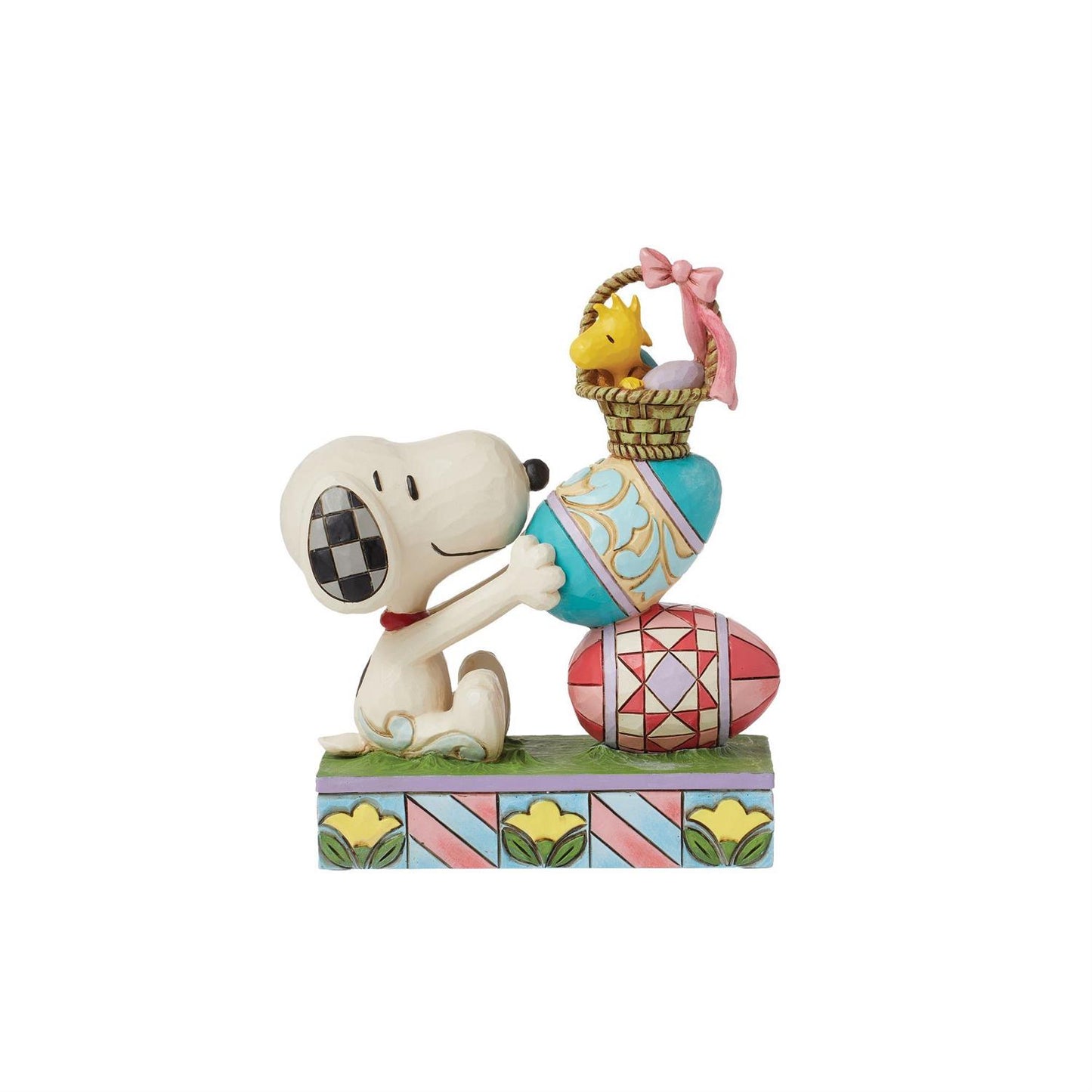 In this charming Jim Shore creation, Snoopy stacks intricately patterned Easter eggs while Woodstock balances atop them inside a basket, enjoying the festive scene below. Jim Shore's details capture the whimsy and joy of Easter and the Peanuts.

Figurine
5.83in H
Jim Shore Peanuts Collection- "Eggcellent Tower"
Beautifully hand-painted and crafted with intricate styling and attention to detail
Jim Shore's style evokes a sense of nostalgia with traditional themes, quilt patterns and design motifs inspired by