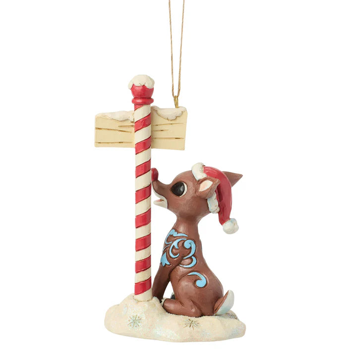 Rudolph by North Pole Sign