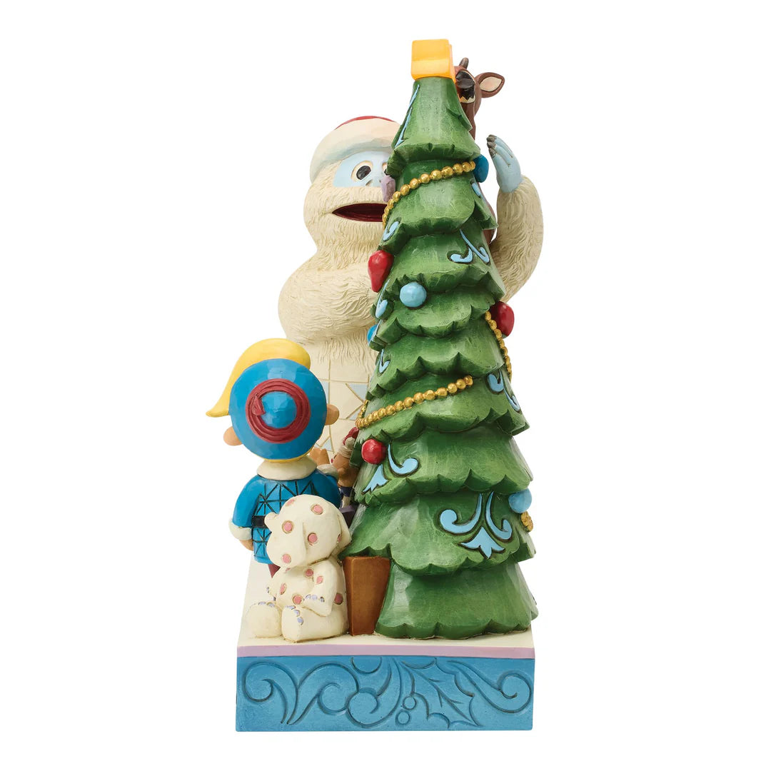 Bumble Holding Rudolph by Tree