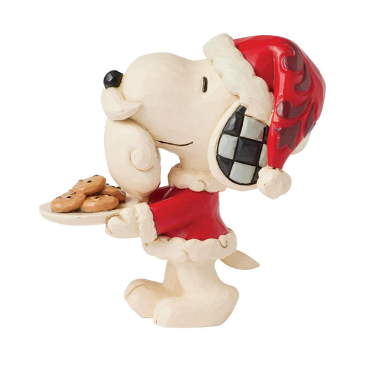 Add a playful touch to your holiday decor with this miniature Jim Shore design of Snoopy dressed as Santa, complete with a fake beard. Carrying a plate of fresh cookies, Snoopy spreads cheer with his joyful spirit and beloved Jim Shore details!