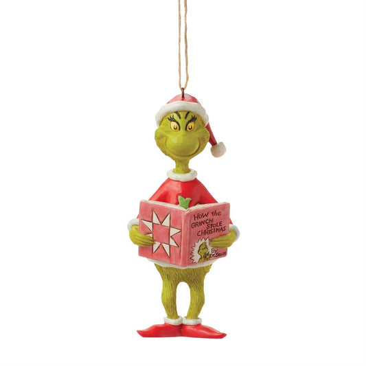 Description
The Grinch wears a rosemaling adorned Santa suit as he studiously reads a copy of How the Grinch Stole Christmas by Dr. Seuss. This Jim Shore ornament captures this whimsical scene with charming detail, as the Grinch studies his own story.
