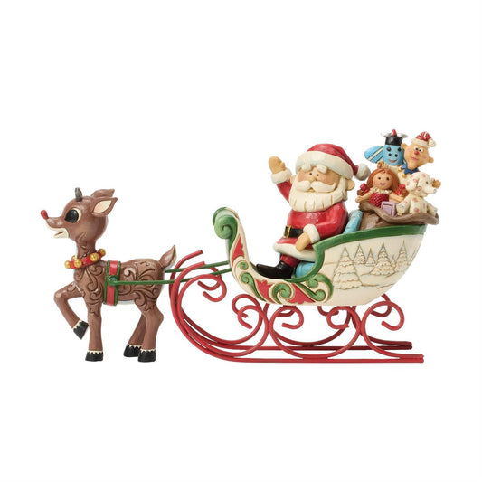 Introduction: January 2025
Description

Celebrate the magic of Christmas Eve with this Jim Shore design of Rudolph pulling Santa's sleigh. Santa waves as the misfit toys prepare for their forever homes, while Rudolph, adorned with holly-inspired rosemaling, launches them into the sky.