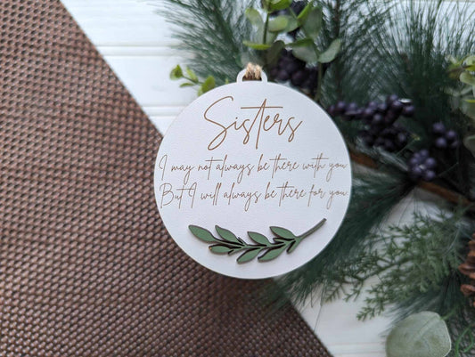 This beautiful ornament features laser cut, engraved, and hand painted details. The sentiment "I may not always be there with you, but I will always be there for you" makes it the perfect gift for a sister who is always there for you. Show your appreciation with this heartfelt ornament.