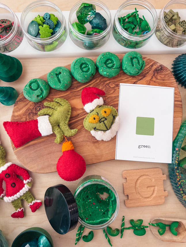 Sewing Seeds Play - One Felt Grinch Hand Holding An Ornament 