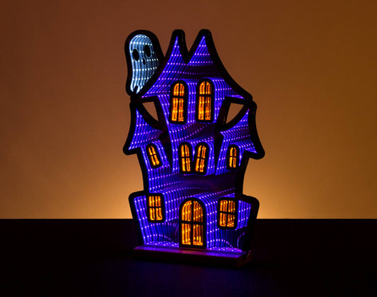 Experience the best-selling LED Infinity Lights of the year with our 15.5" Haunted House with Ghost Halloween edition. Energy efficient and long lasting LED light strips illuminate a spooky black and purple haunted house, with a ghost peeking out for added fright. Perfect for decorating your home this Halloween.
