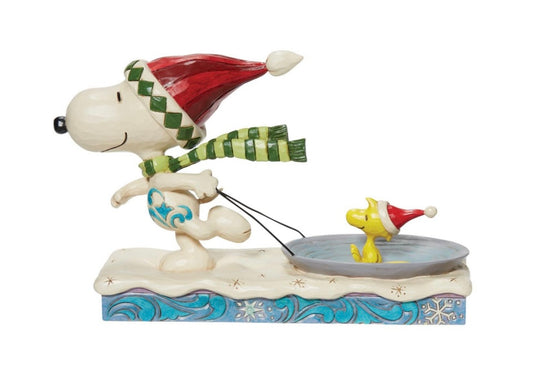 Snoopy Pulling Woodstock on a Saucer