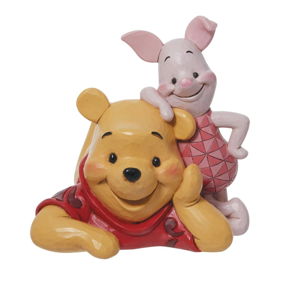 Best friends Piglet and Pooh Bear relax together in this charming Disney creation. A colorful ode to love and friendship, the pair look dashing in classic Jim Shore design. Smiling, they celebrate the 45th anniversary of Winnie the Pooh.

Figurine
5.25in H